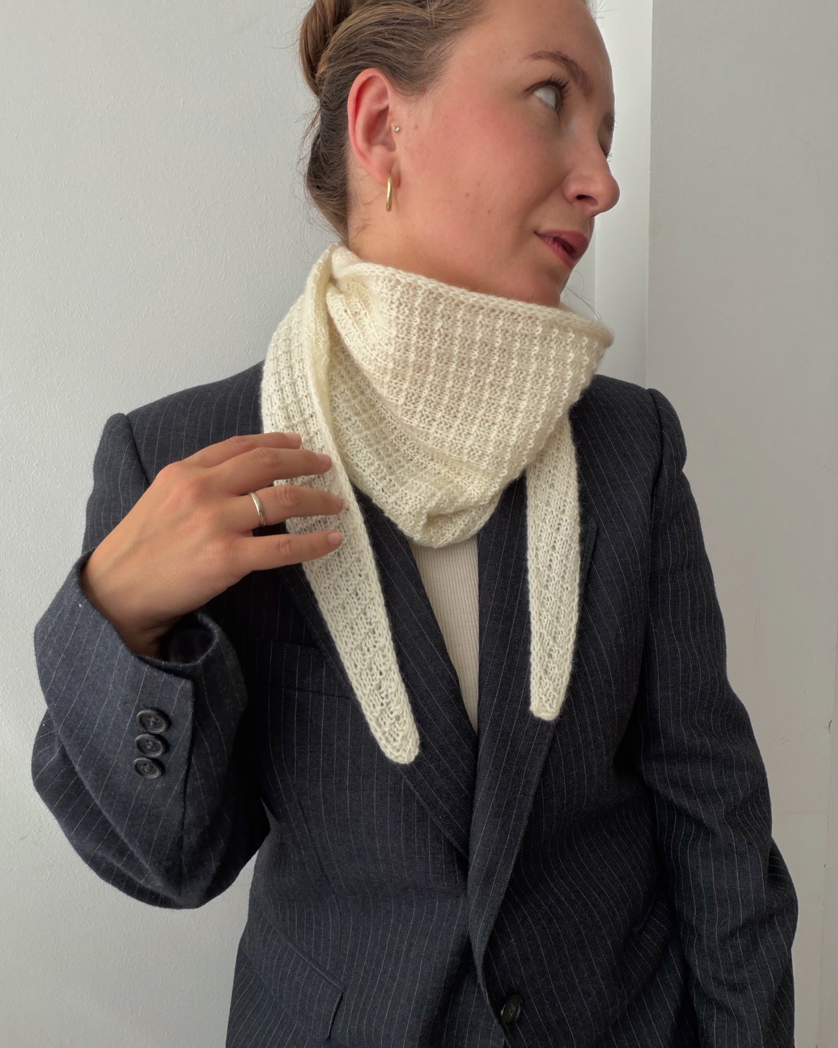 Cream Amelle Scarf styled with a dark suit