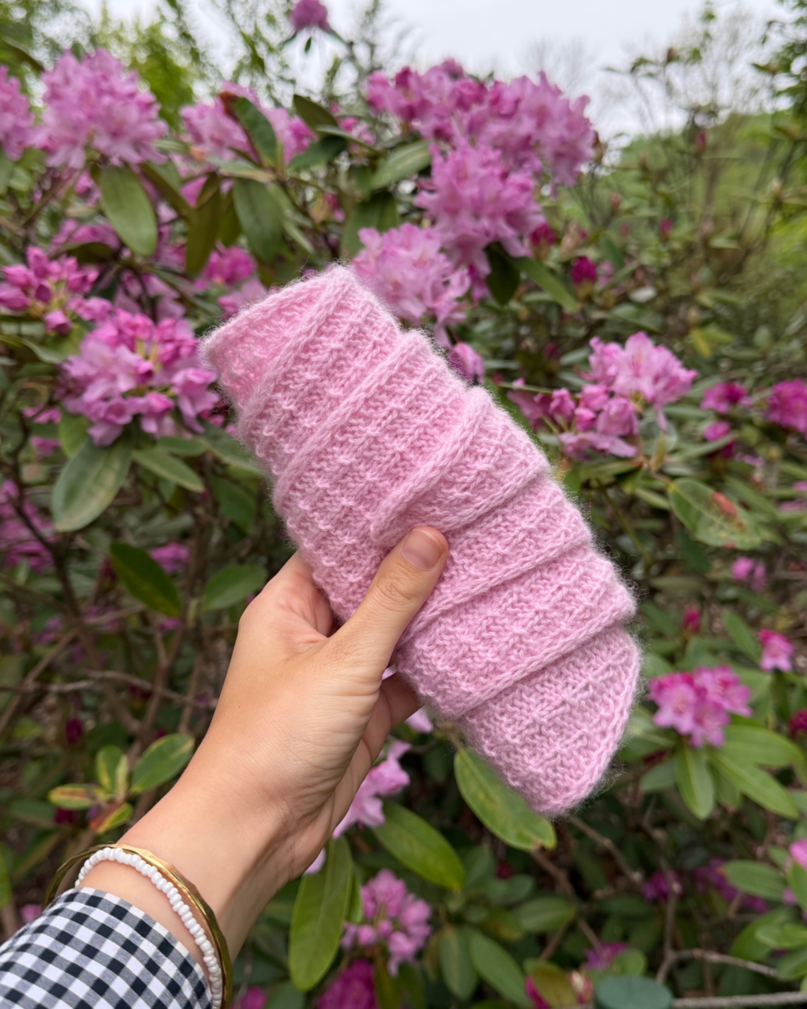 Pink Amelle Scarf surrounded by pink flowers
